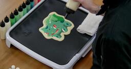 Bulbasaur pancake art step 7.2: When you complete the outline, it will lend extra body to your pancake and make the art on the other side pop.