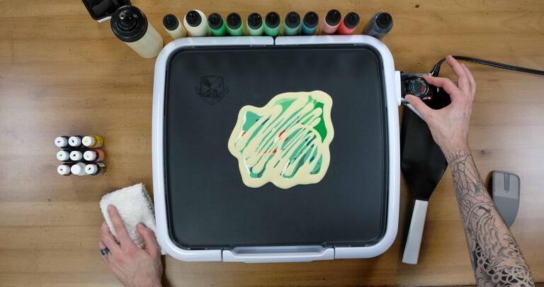 Bulbasaur pancake art step 8.1: When your design is totally filled and you've outlined and backed the pancake, turn your griddle on to approximately 225 degrees fahrenheit.