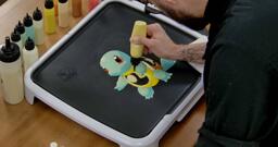 Squirtle Pancake Art step 5.2: With the lighter yellow batter, fill Squirtle's chest.