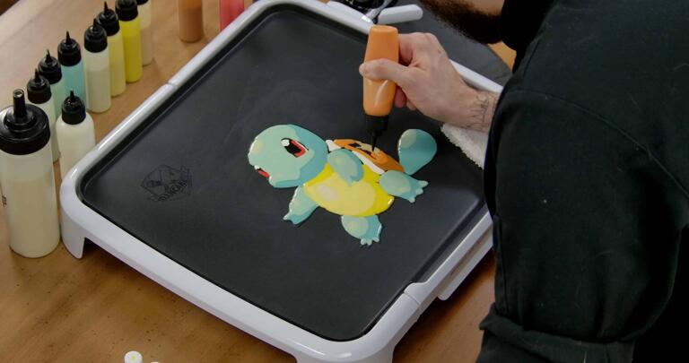 Squirtle Pancake Art step 5.3: Finally, fill in the rest of Squirtle's shell with your bold orange batter.