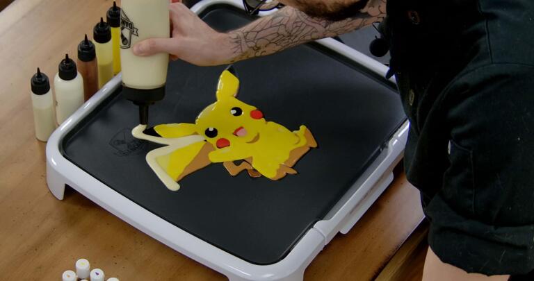 Pikachu Pancake Art step 7.1: Once your pancake design is filled in, I like to add a solid outline of plain batter all around the edges. This makes the pancake stronger, makes the design pop, and gives you a little extra to snack on!