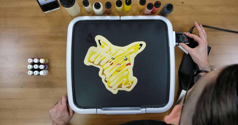 Pikachu Pancake Art step 8.1: Once your pancake design is filled, outlined, and there's nothing else to add, it's time to cook! I usually cook my pancakes around 225 degrees - hot enough to cook the batter, but not hot enough to brown it so much that you lose your color fidelity. Remember not to touch the surface of the griddle after this! You can burn yourself, so be careful.