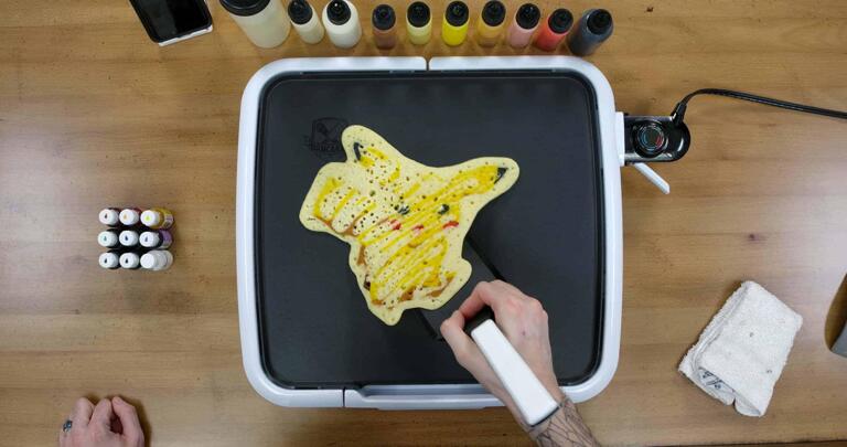 Pikachu Pancake Art step 8.3: You'll know that your pancake is ready to flip when the whole thing slides easily across the surface of the griddle. When it moves, you're ready to flip!