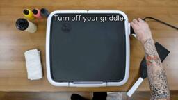 An image of the artist reaching forward and turning the griddle thermostat to 'off'. Text on the image reads "Turn off your griddle."